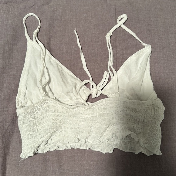 A cute white crop top from garage! It is size medium and super stretchy ! - Picture 2 of 2